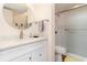 Updated bathroom featuring a modern vanity, round mirror, and walk-in shower at 491 Ocean Creek Dr. # 2613, Myrtle Beach, SC 29572