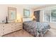Cozy bedroom featuring a queen bed, a mirror, and bright lamps for a comfy retreat at 491 Ocean Creek Dr. # 2613, Myrtle Beach, SC 29572