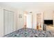 This bedroom features neutral walls, double closets and an ensuite bathroom at 491 Ocean Creek Dr. # 2613, Myrtle Beach, SC 29572