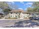 Inviting two-story condo building featuring charming stairs and well-maintained landscaping with ample parking space at 491 Ocean Creek Dr. # 2613, Myrtle Beach, SC 29572