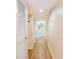Hallway with wood floors, light walls, and closet doors at 491 Ocean Creek Dr. # 2613, Myrtle Beach, SC 29572
