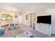 Open-concept living and dining area with a view of the kitchen and sliding doors to the outdoor balcony at 491 Ocean Creek Dr. # 2613, Myrtle Beach, SC 29572