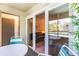 Inviting patio with outdoor seating and a view of the living area through sliding glass doors at 491 Ocean Creek Dr. # 2613, Myrtle Beach, SC 29572
