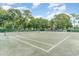 Well-maintained tennis court with mature trees, providing shade and an active lifestyle for community members at 491 Ocean Creek Dr. # 2613, Myrtle Beach, SC 29572