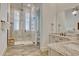 Beautiful bathroom featuring a tiled shower with glass door, rainfall shower head, and granite vanity at 4934 Salt Creek Ct., North Myrtle Beach, SC 29582