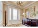 Well-lit entryway with chandelier and large credenza at 4934 Salt Creek Ct., North Myrtle Beach, SC 29582