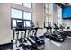 Well-equipped gym with floor to ceiling windows and modern elliptical machines at 4934 Salt Creek Ct., North Myrtle Beach, SC 29582