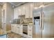 Secondary kitchen area with stainless steel refrigerator and granite countertops at 4934 Salt Creek Ct., North Myrtle Beach, SC 29582