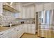 Modern kitchen with stainless steel appliances, custom cabinets, and mosaic backsplash at 4934 Salt Creek Ct., North Myrtle Beach, SC 29582