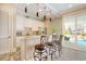Kitchen area with breakfast bar and backyard pool views at 4934 Salt Creek Ct., North Myrtle Beach, SC 29582