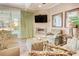 Living room with fireplace, tv, and poolside views at 4934 Salt Creek Ct., North Myrtle Beach, SC 29582
