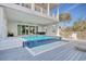 Backyard pool with tanning ledge and views of the upper level balcony at 4934 Salt Creek Ct., North Myrtle Beach, SC 29582