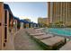 Relaxing pool deck with comfortable lounge chairs and shaded cabanas near the pool at 4934 Salt Creek Ct., North Myrtle Beach, SC 29582