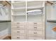 Well-organized walk-in closet with built-in shelves and drawers for storage at 4934 Salt Creek Ct., North Myrtle Beach, SC 29582