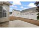 Fenced backyard featuring a concrete patio and view of neighboring homes at 5077 Capulet Circle, Myrtle Beach, SC 29588