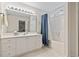 Bathroom with a large mirror, vanity with ample storage, and a shower tub with curtain at 5077 Capulet Circle, Myrtle Beach, SC 29588
