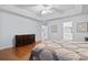 Comfortable bedroom featuring tray ceiling and hardwood floors at 5077 Capulet Circle, Myrtle Beach, SC 29588
