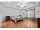 Inviting bedroom with tray ceilings, hardwood floors and ample natural light at 5077 Capulet Circle, Myrtle Beach, SC 29588