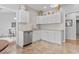 Modern kitchen featuring white cabinets, mosaic backsplash, stainless steel appliances, and granite countertops at 5077 Capulet Circle, Myrtle Beach, SC 29588