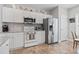 Well-equipped kitchen with stainless steel appliances, tiled backsplash and stylish decor atop the cabinets at 5077 Capulet Circle, Myrtle Beach, SC 29588