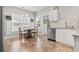 Sunlit kitchen with a dining table next to bright windows and stainless steel appliances at 5077 Capulet Circle, Myrtle Beach, SC 29588