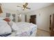 This bedroom features a ceiling fan, a closet with sliding doors, and a television on top of a dresser at 510 Fairwood Lakes Ln. # 20E, Myrtle Beach, SC 29588