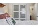 The bedroom includes a closet with sliding doors, plush pillows, and views into the attached bathroom at 510 Fairwood Lakes Ln. # 20E, Myrtle Beach, SC 29588