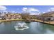 Exterior view of condo building with a fountain and gazebo on a sunny day providing relaxing outdoor area at 510 Fairwood Lakes Ln. # 20E, Myrtle Beach, SC 29588