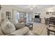 Cozy living room with ceiling fan, comfortable seating and adjacent dining space at 510 Fairwood Lakes Ln. # 20E, Myrtle Beach, SC 29588