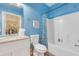 Bright blue bathroom with vanity, granite countertop, and a tub-shower combination at 5825 Catalina Dr. # 531, North Myrtle Beach, SC 29582