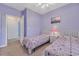 This bedroom features two twin beds, carpet floors, and soft lavender walls at 5825 Catalina Dr. # 531, North Myrtle Beach, SC 29582