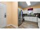 Modern kitchen with white cabinets, stainless steel appliances, and wood-look flooring at 5825 Catalina Dr. # 531, North Myrtle Beach, SC 29582