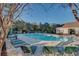 Community pool surrounded by lounge chairs and trees, with a restroom building visible at 5825 Catalina Dr. # 531, North Myrtle Beach, SC 29582