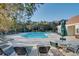 Large community pool surrounded by lounge chairs, tables, and a restroom building with a lifeguard ring at 5825 Catalina Dr. # 531, North Myrtle Beach, SC 29582