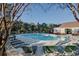 Community pool surrounded by lounge chairs and trees, with a restroom building visible at 5825 Catalina Dr. # 531, North Myrtle Beach, SC 29582