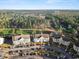 Aerial view of condos, parking lots, and the golf course in a picturesque community at 5834 Longwood Dr. # 303, Murrells Inlet, SC 29576