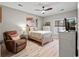 Cozy bedroom with a comfortable bed, brown recliner chair, and plenty of natural light at 5834 Longwood Dr. # 303, Murrells Inlet, SC 29576