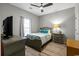 Cozy bedroom with a ceiling fan, wood-look flooring, and neutral gray walls at 5834 Longwood Dr. # 303, Murrells Inlet, SC 29576