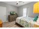 Comfortable bedroom featuring wood-look flooring, ceiling fan and natural light at 5834 Longwood Dr. # 303, Murrells Inlet, SC 29576