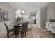 Open-concept dining area featuring chandelier and modern furnishings at 5834 Longwood Dr. # 303, Murrells Inlet, SC 29576