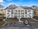 Attractive three-story condo with white columns, multiple balconies and ample parking at 5834 Longwood Dr. # 303, Murrells Inlet, SC 29576
