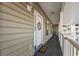 Charming front porch with a decorative door and a welcoming 'Live, Laugh, Love' door mat at 5834 Longwood Dr. # 303, Murrells Inlet, SC 29576