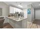 Modern kitchen with stainless steel appliances, granite countertops, and a breakfast bar at 5834 Longwood Dr. # 303, Murrells Inlet, SC 29576