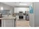 Well-equipped kitchen featuring stainless steel appliances, white cabinets, and ample counter space at 5834 Longwood Dr. # 303, Murrells Inlet, SC 29576