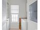 Bright laundry room with window and white washer and dryer at 5834 Longwood Dr. # 303, Murrells Inlet, SC 29576