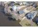 Aerial view of a waterfront community with multiple homes and private docks along the river at 5865 Creekside Dr., Myrtle Beach, SC 29588