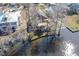 Aerial view showcasing the house situated on the water, with surrounding trees and landscape at 5865 Creekside Dr., Myrtle Beach, SC 29588