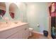 Bathroom featuring dual sinks, updated fixtures and plenty of vanity storage at 5865 Creekside Dr., Myrtle Beach, SC 29588