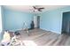 Bright bedroom with light blue walls, gray flooring and tools on the ground at 5865 Creekside Dr., Myrtle Beach, SC 29588