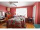 Cozy bedroom with wood floors, a ceiling fan, and natural light at 5865 Creekside Dr., Myrtle Beach, SC 29588